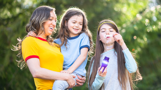 Woman and her children appreciates her employer offering Trustmark Paycheck Protect as livability insurance